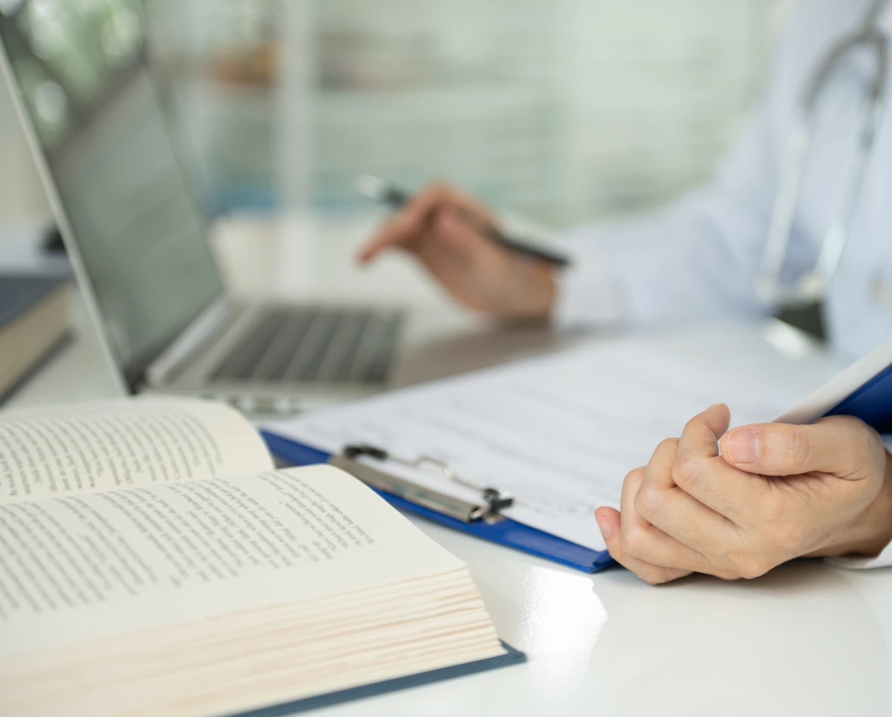 Medical professional reviewing documents