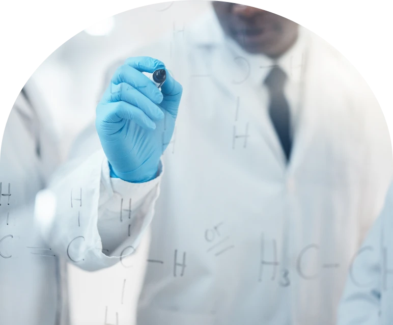 Researcher in lab coat with blue glove